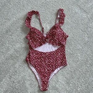 One piece swimsuit with ruffles and front cutout